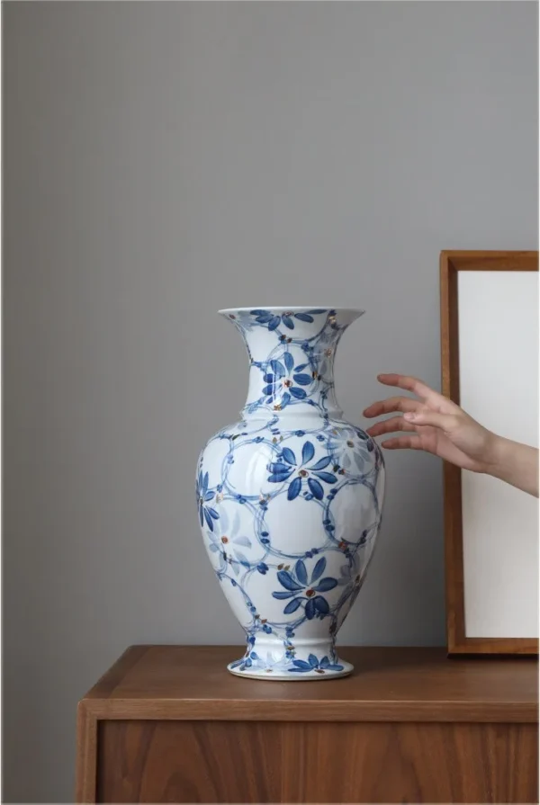 Hand-Painted Blue and White Gilded Fishtail Floor Vase in blue — in a room setting