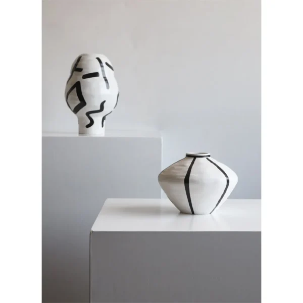 White Ceramic Lantern Vase with Black Lines, Medium in ivory — in a room setting