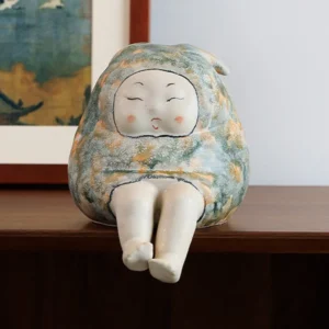 Smiling Face Seated Figure Ceramic Sculpture in olive — front view