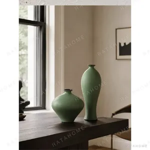 Designer Matte Celadon Vases in olive — in a room setting