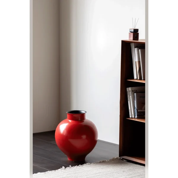 Cinnabar Red Glossy Round-Belly Ceramic Vase with Flared Lip in red — in a room setting