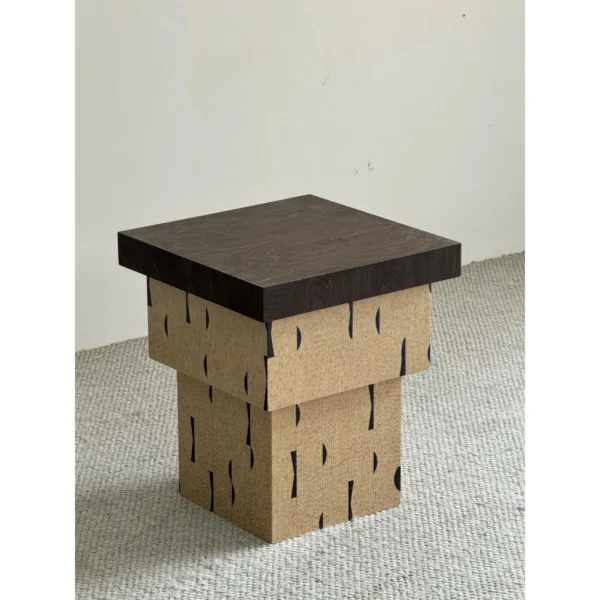 Cork and Dark Wood Stacked Block Side Table in black — in a room setting
