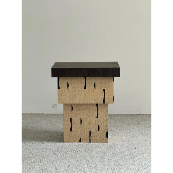 Cork and Dark Wood Stacked Block Side Table in black — in a room setting