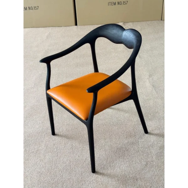 Black Bentwood Sculptural Dining Chair with Tan Leather Seat in black — in a room setting