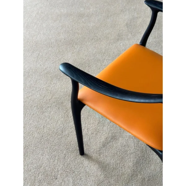 Black Bentwood Sculptural Dining Chair with Tan Leather Seat in black — in a room setting