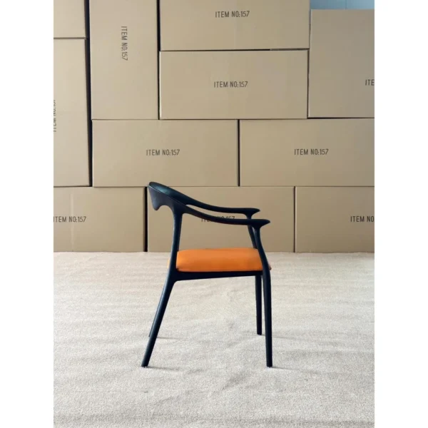 Black Bentwood Sculptural Dining Chair with Tan Leather Seat in black — in a room setting