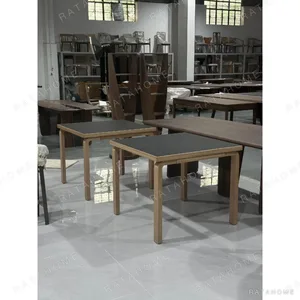 Nordic Black-Top Dining Table with Oak Legs in black — in a room setting