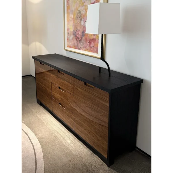 Noye Smoked Oak and Gloss Walnut Sideboard in black — in a room setting