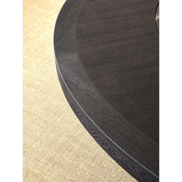 Matte Black Brushed Oak Round Table with Stone Lazy Susan in black — in a room setting