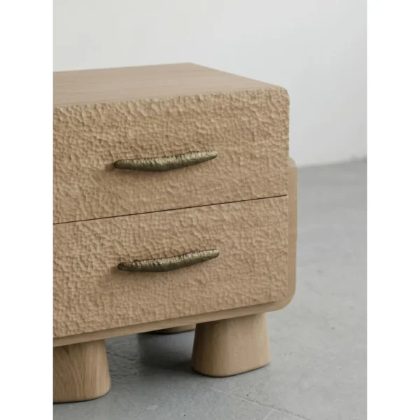 Hand-Chiselled White Oak Nightstand on Sculpted Legs in natural oak — in a room setting