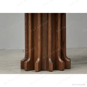 Oak Oval Dining Table on Fluted Post Bases in walnut — in a room setting