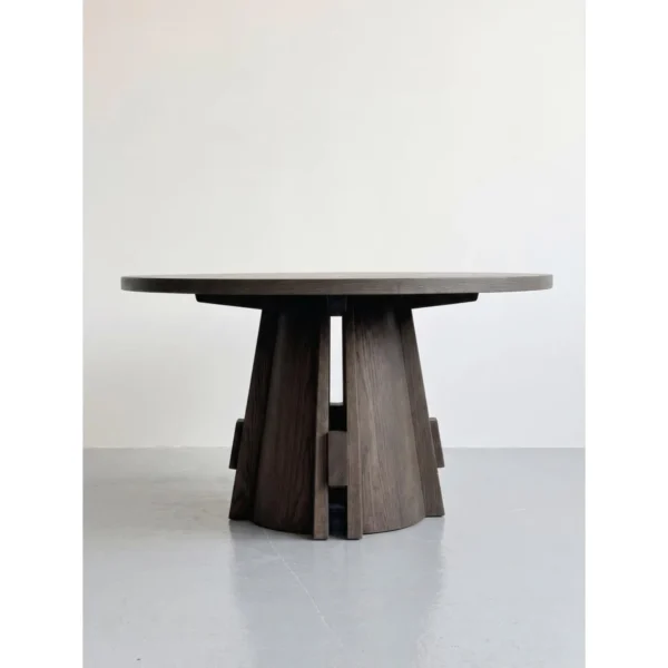 Dark Oak Round Table on Architectural Slab Base in walnut — in a room setting