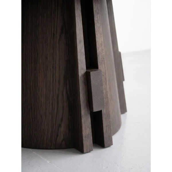 Dark Oak Round Table on Architectural Slab Base in walnut — in a room setting