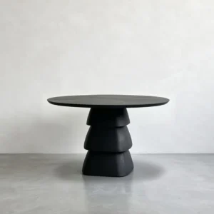 Black Oak Round Table on Stacked Sculptural Pedestal in black — front view