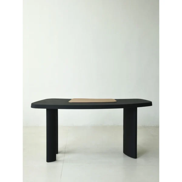 Matte Black Oak Desk with Curved End and Leather Inset in black — in a room setting