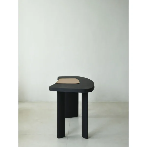 Matte Black Oak Desk with Curved End and Leather Inset in black — in a room setting
