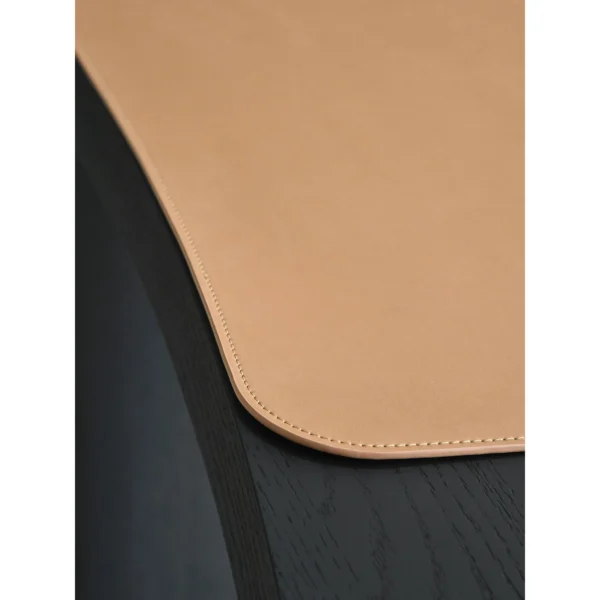 Matte Black Oak Desk with Curved End and Leather Inset in black — in a room setting