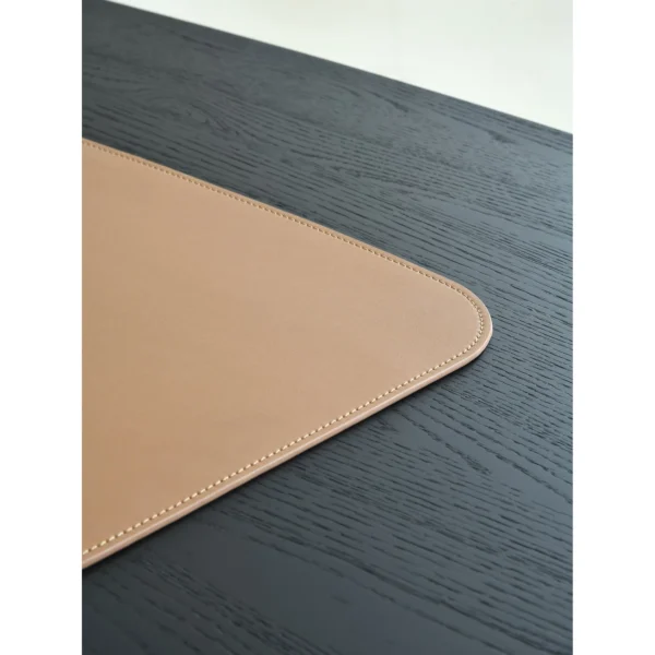 Matte Black Oak Desk with Curved End and Leather Inset in black — in a room setting