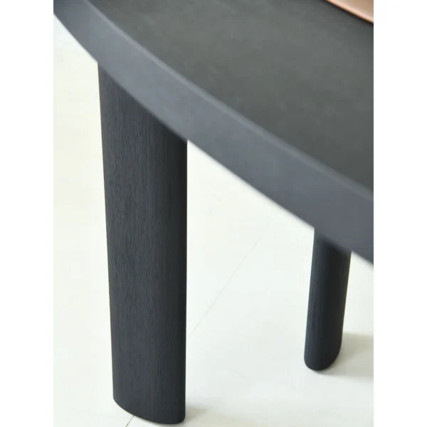 Matte Black Oak Desk with Curved End and Leather Inset in black — in a room setting