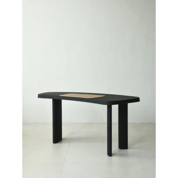 Matte Black Oak Desk with Curved End and Leather Inset in black — in a room setting
