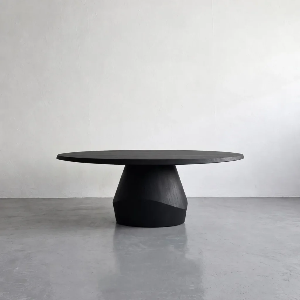 Matte Black Oak Round Dining Table on Faceted Pedestal in black — front view