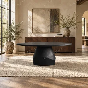 Matte Black Oak Round Dining Table on Faceted Pedestal in black — in a room setting