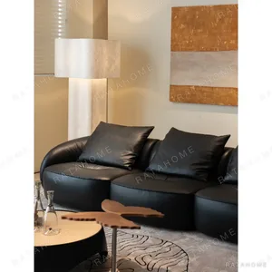 Obsidian Black Leather Sofa with Down Cushions, 304 cm in black — in a room setting