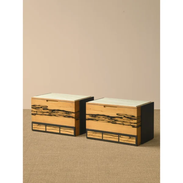 Black and White Ebony Veneer Nightstand with Stone Top in black — in a room setting