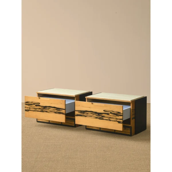 Black and White Ebony Veneer Nightstand with Stone Top in black — in a room setting