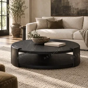 Round Black Oak Coffee Table with Brass Detail, 130 cm in black — in a room setting