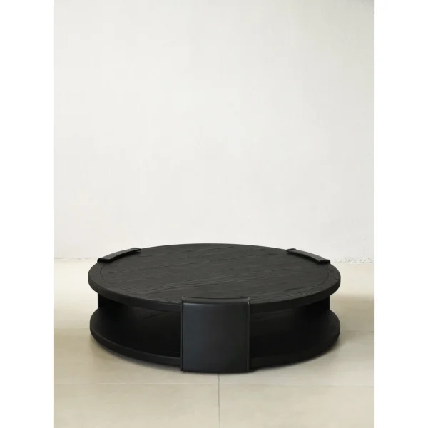 Round Black Oak Coffee Table with Brass Detail, 130 cm in black — in a room setting