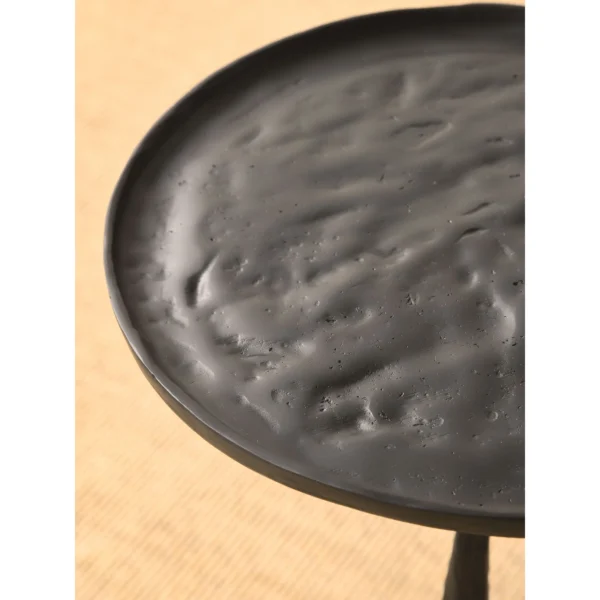 Hand-Forged Brass Tripod Side Table with Textured Top in black — in a room setting