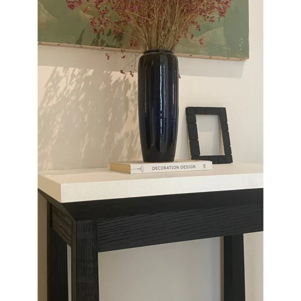Black Lacquer Side Table with Pale Top in black — in a room setting