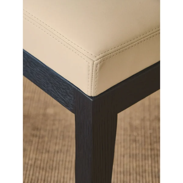 Black Oak Dining Chair with Cream Leather and Wrapped Arms in oatmeal — in a room setting