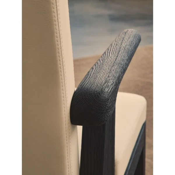 Black Oak Dining Chair with Cream Leather and Wrapped Arms in oatmeal — in a room setting