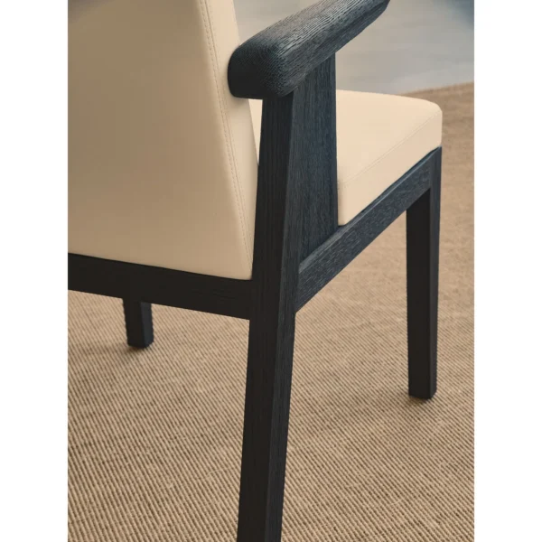 Black Oak Dining Chair with Cream Leather and Wrapped Arms in oatmeal — in a room setting