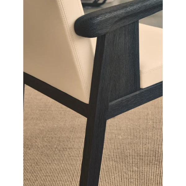 Black Oak Dining Chair with Cream Leather and Wrapped Arms in oatmeal — in a room setting