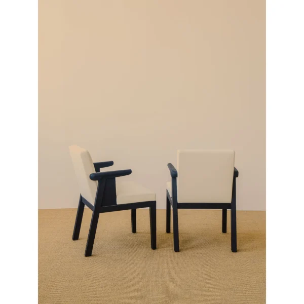 Black Oak Dining Chair with Cream Leather and Wrapped Arms in oatmeal — in a room setting