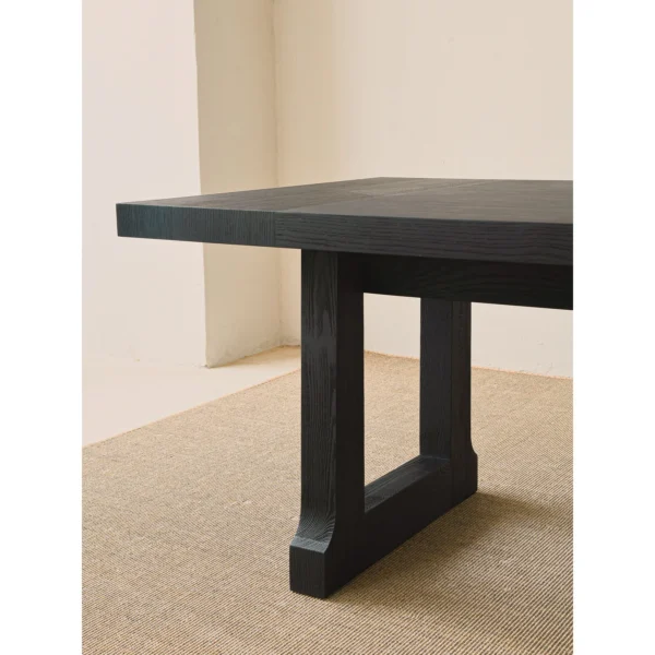 Matte Black Brushed Oak Long Dining Table in black — in a room setting