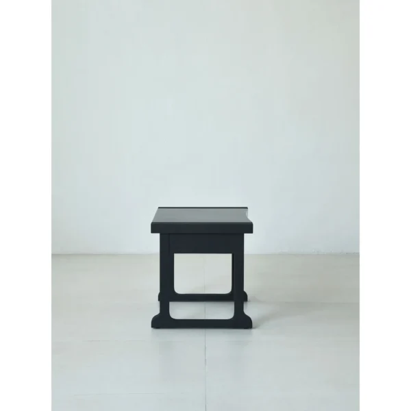 Matte Black Brushed Oak Nightstand on Sled Base in black — in a room setting