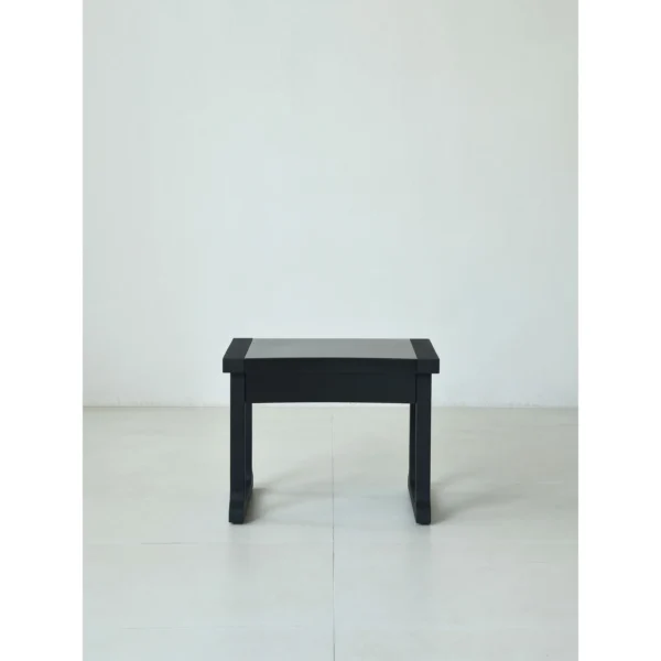 Matte Black Brushed Oak Nightstand on Sled Base in black — in a room setting