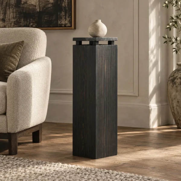 Sandblasted Cedar Pedestal with Stone Top, 110 cm in black — in a room setting