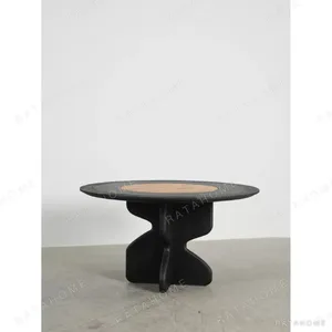 Black Oak Round Dining Table in black — in a room setting