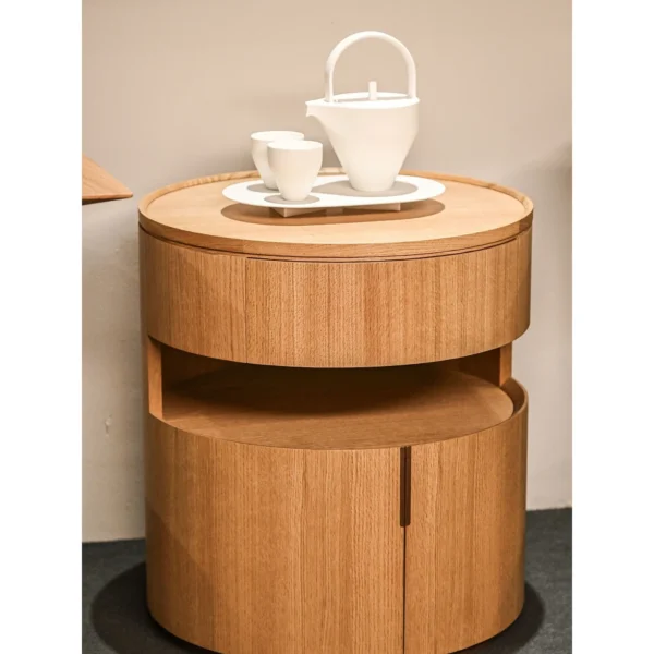 Open Mouth Solid Wood Nightstand with Three Storage Levels in natural oak — in a room setting