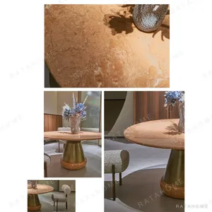 Orange Ice Jade Round Dining Table on Sculpted Stone Base in rust — in a room setting