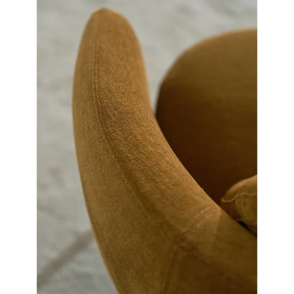 Curved Lounge Chair in Caramel Fabric on Slim Metal Legs — in a room setting