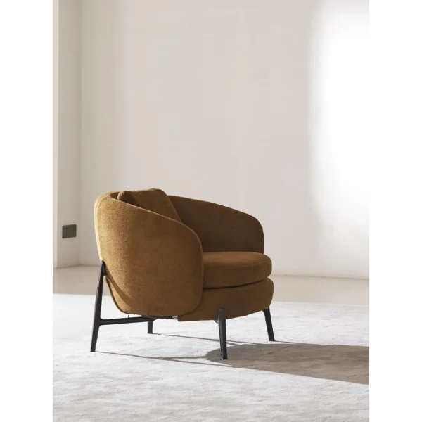 Curved Lounge Chair in Caramel Fabric on Slim Metal Legs — in a room setting