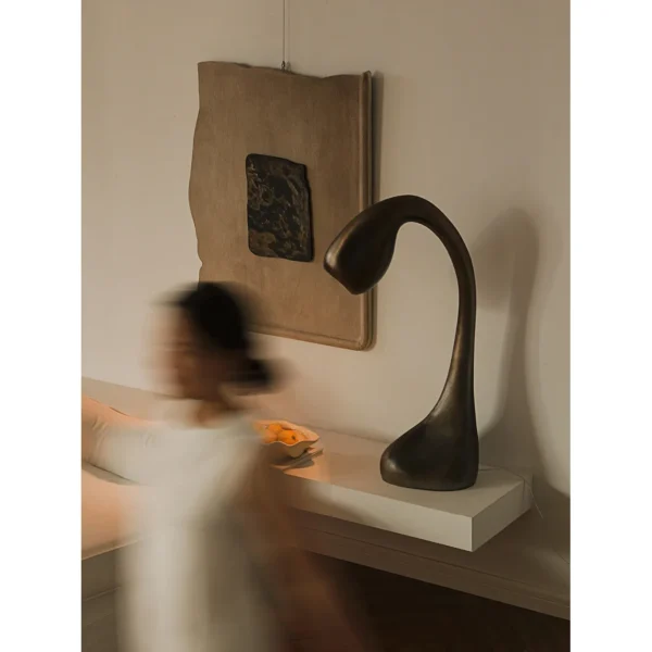 Swan Neck Sculptural Floor Lamp in Bronze — in a room setting