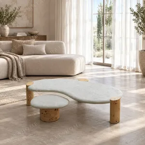 Organic White Stone Coffee Table Pair on Burl Cylinder Legs in ivory — in a room setting