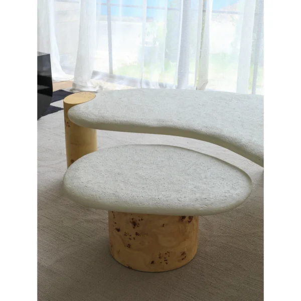 Organic White Stone Coffee Table Pair on Burl Cylinder Legs in ivory — in a room setting
